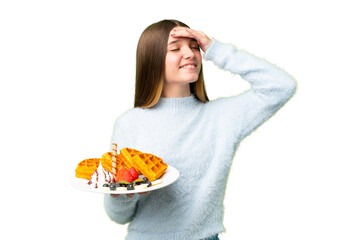 Poster - Teenager girl holding waffles over isolated chroma key background smiling a lot