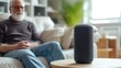 © Rodica - Senior using voice controlled smart speaker and personal asistent, smart device concept, technologies, gadget, background minimalistic. Concept of Smart Home and Automation