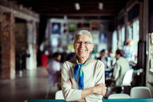Portrait Of A Senior Caucasian Woman With Crossed Arms Working In A Startup Company Office