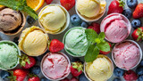 Fototapeta Tęcza - Ice cream assortment. Selection of colorful ice cream with berries and fruits on rustic table. Top view