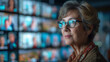 © Naret - An empowered senior businesswoman confidently participates in a virtual meeting, showcasing professional confidence and leadership..