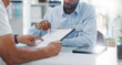 © Wesley/peopleimages.com - Man, doctor and hands with form in consultation for signature, application or health insurance at hospital. Closeup of person or medical employee explaining document or paperwork to patient at clinic