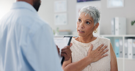 Wall Mural - Patient, doctor and chest pain for consultation advice with clipboard for checklist or inflammation, Indigestion or infection. Female person, wellness and retirement or lung illness, healing or help