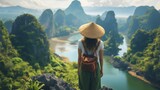 Fototapeta Most - A young woman stands with her back and admires the view of the Asia. A traveler traveling on vacation in the most beautiful place in the world. Summer vacation