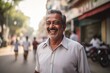 © blvdone - Indian man smiling happy face on city street