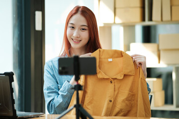 Entrepreneur Showcasing Clothes for Online Store