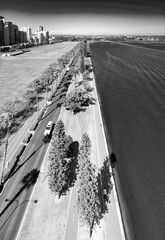 Wall Mural - Promenade along the city river, aerial view on a sunny day