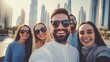 © yana136 - a group of international friends of young guys and girls are walking around Dubai and taking selfies
