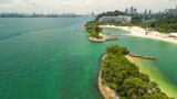 Fototapeta Mosty linowy / wiszący - Sentosa Beach, Singapore. Aerial view of beach and coastline on a sunny day