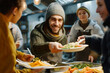 © Lazy_Bear - Volunteer serving food at a homeless shelter, Donate food to hungry people
