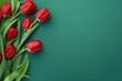 Banner with bouquet of red tulips on the green background. 