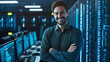 Confident IT engineer standing in server room data center arms crossed and smiling