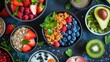  a table topped with bowls of fruit and a bowl of oatmeal next to kiwis, strawberries, kiwis, kiwis, and kiwis.