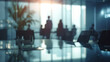 © MP Studio - silhouettes of business people are seen in a meeting room