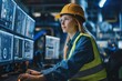 © Joaquin Corbalan - Female engineer works in the control post of a power plant, monitoring the safety of the plant.