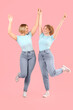 © Pixel-Shot - Beautiful happy women in stylish jeans on pink background