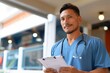 © LifeMedia - A smiling man in a crisp polo shirt holds a clipboard, ready to provide compassionate care indoors