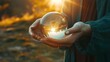Woman holding a beautiful crystal ball in her hands. Close up