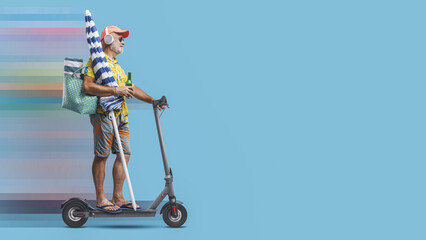 Canvas Print - Senior man going to the beach with an electric scooter