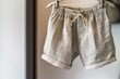 linen shorts on hanger, natural light, clean look