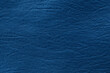 Dark blue leather texture background with seamless pattern and high resolution.
