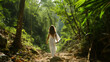 © MYDAYcontent - A woman wearing a white dress stands surrounded by trees in a forest setting.