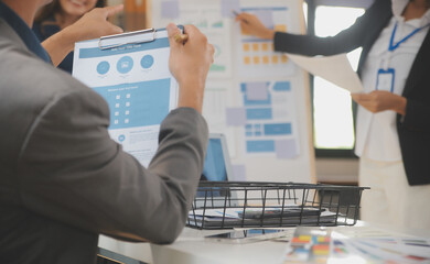 Close up ux developer and ui designer use augmented reality brainstorming about mobile app interface wireframe design on desk at modern office.Creative digital development agency