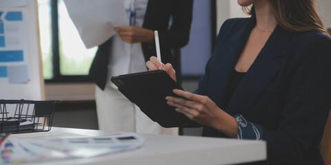 Close up ux developer and ui designer use augmented reality brainstorming about mobile app interface wireframe design on desk at modern office.Creative digital development agency