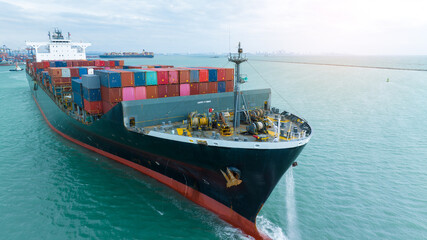 side view Cargo Container ship with contrail in the ocean ship carrying container and running for import export concept technology freight shipping by ship