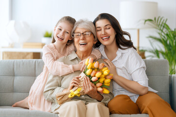 Poster - child, mother and granny with flowers