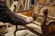 craftsperson inspecting the frame of a settee for restoration
