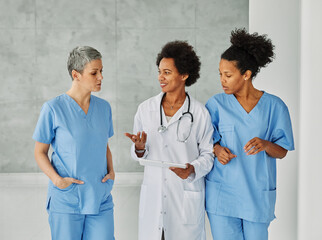 Wall Mural - doctor hospital team medical nurse health medicine healthcare meeting teamwork tablet computer technology clinic office