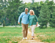 © Lumos sp - woman man mature couple happy together active bonding park outdoor middle aged talking leisure park fun smiling love old middle mid aged nature wife walking