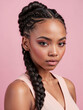 © Hamza - Black woman, showcasing a detailed braid hairstyle against a pink background