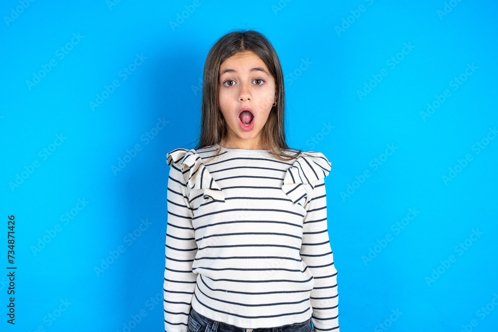Oh my God. Surprised Young beautiful teen girl wearing striped T-shirt ...