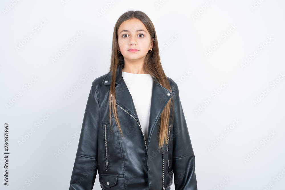 Stunned Young beautiful teen girl wearing biker jacket stares reacts on ...