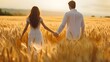 Happy happiness marry couple lover young couple having fun Couple holding hands on a golden field in wheat field sunset summertime joyful moment
