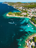 Fototapeta Łazienka - Aerial view of a serene coastal town surrounded by turquoise waters. Croatia