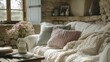 Cottage living room snug with knit blanket in pastel soft pop on sofa