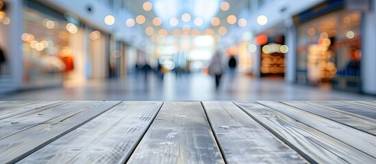 Wall Mural - empty wooden table poised as perfect stage for showcasing products background is blur of bustling co