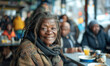 © Cantarela - Positive elderly African American homeless woman with smile, homeless cafe.Urban poverty and hunger concept. Street lifestyle and survival.