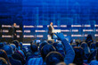 © Anton Gvozdikov - Business event attendees recording speaker on stage giving a professional presentation.