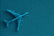 Volumetric silhouette of a passenger airliner on a blue abstract background of many small spherical mosaic details. Symbolic of tourism, air travel, vacation or relocation. Photo