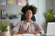 Business woman, corporate company worker, secretary or financial accountant doing stress relieving practices at work. Beautiful relaxed African American girl sitting at office desk and meditating