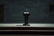 lonely podium with a microphone on a stage, no audience