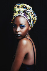 Wall Mural - Black woman, beauty and portrait with fashion, hair scarf and makeup in studio. Cosmetics, trendy and afro style with African female person from Kenya with traditional head wrap with black background