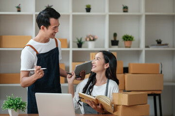 Two women busines startup for online marketing, Entrepreneur packing boxes parcels for shipping, SME sellers, and freelance online sales concept