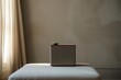 speaker on an ottoman in a minimalist lounge