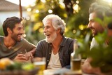 Fototapeta  - Happy Senior Father and Adult Son Sharing a Toast at an Outdoor Gathering