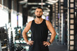 © Prostock-studio - Portrait Of Handsome Muscular Male Athlete Posing In Gym Interior